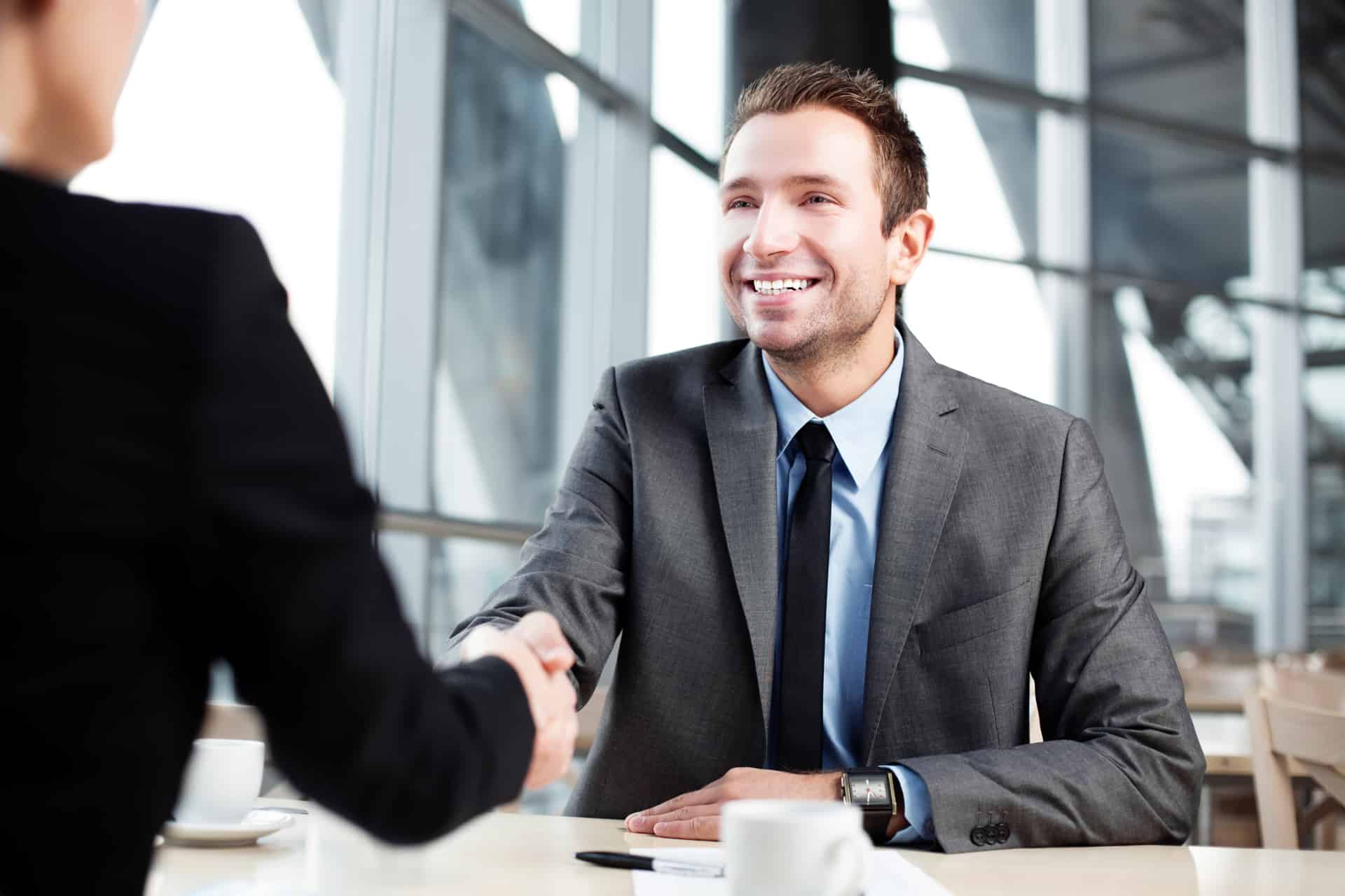 Grow Your Business with Us image of man handshaking to another businessman