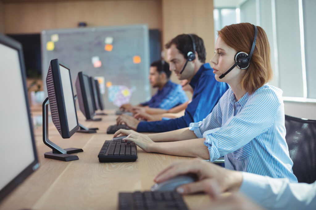 NEARSOL employees collaborating in a modern office environment