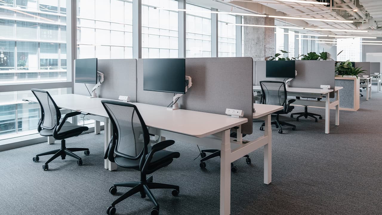 aesthetic,workspace,panoramic,spacious,office,working environment,professional,view,trendy,furniture,computer monitors,chairs,cityscape,creativity,conversation,ergonomic,open-plan,collaborative,pleasant,corporation,natural light,contemporary,green plants,comfortable,professionalism,airy,functional,sophisticated,exposed ducts,bright,desks,ambiance,interior,modern,design,pipes,innovation,ceiling,business,efficient,nature,technology,clean,windows,stylish,industrial,urban,corporate,productive,organized;