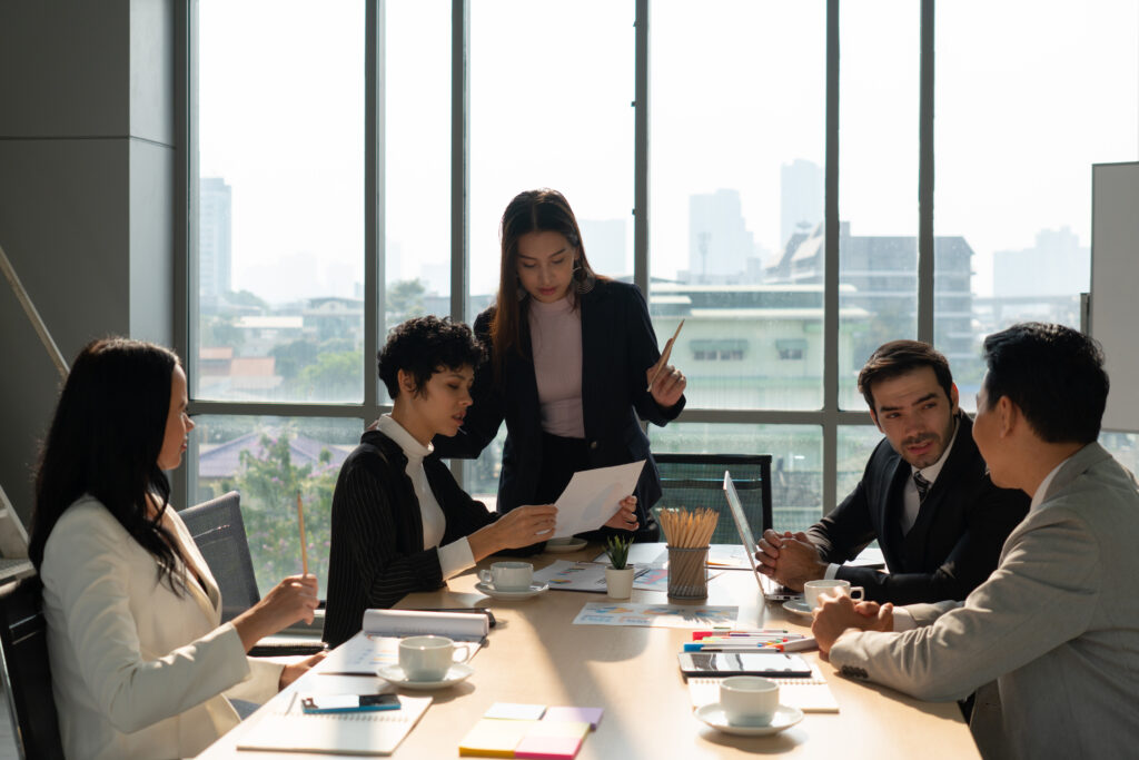 Diverse professional team collaborating in a business meeting in a modern office